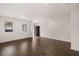 Open-concept living room with wood flooring, white walls, and natural light at 5436 Flat Rock Point Pt, Stonecrest, GA 30038