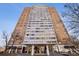 Exterior shot of the tall apartment building showing the entrance and the many apartment windows at 215 Piedmont Ne Ave # 1804, Atlanta, GA 30308