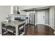 A modern kitchen featuring a stainless steel oven, white cabinets, and a breakfast table at 215 Piedmont Ne Ave # 1804, Atlanta, GA 30308