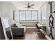 Cozy sunroom with sofa, desk, chair and lots of natural light at 215 Piedmont Ne Ave # 1804, Atlanta, GA 30308