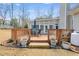 Enjoy outdoor living with this backyard deck with seating, planters, and access to the sunroom at 2175 Ashton Dr, Villa Rica, GA 30180