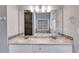 Bathroom vanity with double sinks, granite countertops, and a soaking tub in the background at 2175 Ashton Dr, Villa Rica, GA 30180