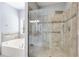 Bathroom boasting a glass enclosed shower, soaking tub, and tile flooring at 2175 Ashton Dr, Villa Rica, GA 30180