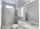 Bathroom featuring a tiled glass shower, granite countertop, and ample lighting at 2175 Ashton Dr, Villa Rica, GA 30180