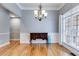 Dining room with hardwood floors, chandelier, and large window with natural light at 2175 Ashton Dr, Villa Rica, GA 30180