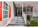 Inviting front porch with red shutters and a view of the front door at 2175 Ashton Dr, Villa Rica, GA 30180