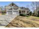 Charming home with a two-car garage, manicured lawn, and inviting front porch at 2175 Ashton Dr, Villa Rica, GA 30180