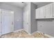 Mudroom with tile floor, storage cabinets, and exterior door at 2175 Ashton Dr, Villa Rica, GA 30180