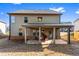 A cozy covered patio offers outdoor living space in the backyard of this home at 3596 Maple Hill Rd, Lithonia, GA 30038