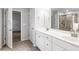 Bathroom with double vanity, tiled floor, and glass shower enclosure at 3596 Maple Hill Rd, Lithonia, GA 30038