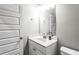 Bathroom with vanity, white cabinets, faucet, sink and mirror at 3596 Maple Hill Rd, Lithonia, GA 30038