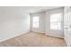 Bedroom with large windows and carpeted floor at 3596 Maple Hill Rd, Lithonia, GA 30038