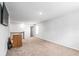 Bonus room with carpeted floors and staircase with wooden handrail at 3596 Maple Hill Rd, Lithonia, GA 30038