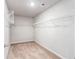 Walk-in closet with white metal shelves and carpeted floor at 3596 Maple Hill Rd, Lithonia, GA 30038