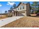 Beautiful two-story home with a two-car garage and green space, perfect for outdoor living at 3596 Maple Hill Rd, Lithonia, GA 30038