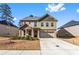 Attractive home with brick and siding exterior, complemented by a green lawn and driveway at 3596 Maple Hill Rd, Lithonia, GA 30038