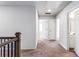 Hallway showcasing neutral walls and flooring, leading to various rooms at 3596 Maple Hill Rd, Lithonia, GA 30038