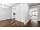 Living room boasting hardwood floors, white crown molding, and an open floor plan at 3596 Maple Hill Rd, Lithonia, GA 30038