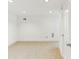 Bright unfinished basement with neutral carpet, white walls and recessed lighting, perfect for storage at 869 Briarcliff Ne Rd # B25, Atlanta, GA 30306