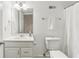 Bathroom featuring a white vanity, toilet, sink and neutral accents, with good lighting at 869 Briarcliff Ne Rd # B25, Atlanta, GA 30306