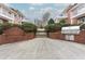 Brick walkway featuring a grill and outdoor seating near condominium buildings at 869 Briarcliff Ne Rd # B25, Atlanta, GA 30306