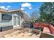 Back deck featuring comfortable seating and outdoor space with a view of the yard and trees at 949 Park Se Ave, Atlanta, GA 30315