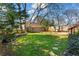 Well-manicured backyard with a lush lawn, landscaped garden beds, and a stone pathway at 949 Park Se Ave, Atlanta, GA 30315