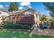 Charming backyard with a wooden deck, lush lawn, fire pit and blue Adirondack chairs at 949 Park Se Ave, Atlanta, GA 30315