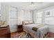 Bright bedroom with plush carpeting, neutral walls and a patterned bedspread at 949 Park Se Ave, Atlanta, GA 30315