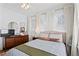 Well-lit bedroom featuring plush carpeting, neutral walls, and a patterned bedspread at 949 Park Se Ave, Atlanta, GA 30315