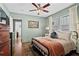 Comfortable bedroom showcasing neutral walls, hardwood floors and well-lit windows, complete with charming, vintage furnishings at 949 Park Se Ave, Atlanta, GA 30315