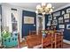 Traditional dining room featuring a wooden table, accent furniture, and stylish light fixture at 949 Park Se Ave, Atlanta, GA 30315