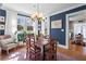 Elegant dining room with navy walls, hardwood floors, and bright natural light at 949 Park Se Ave, Atlanta, GA 30315