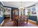 Stylish dining room featuring hardwood floors, modern lighting, and a view into the living room at 949 Park Se Ave, Atlanta, GA 30315