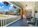 Charming front porch with comfortable seating, and views of the neighborhood street at 949 Park Se Ave, Atlanta, GA 30315