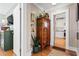 Hallway with hardwood floors, decorative armoire and doorway leading to kitchen at 949 Park Se Ave, Atlanta, GA 30315