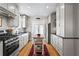 Bright, updated kitchen with white cabinets, stainless steel appliances, and hardwood floors at 949 Park Se Ave, Atlanta, GA 30315