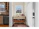 Mud room featuring brick floors, decorative wallpaper, and storage cabinets with wicker baskets at 949 Park Se Ave, Atlanta, GA 30315