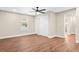 Bedroom boasts laminate floors, a ceiling fan, closet doors, and natural light from windows at 200 Adeline Nw Ave, Atlanta, GA 30314