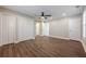 Bedroom featuring laminate floors, a ceiling fan, closet doors, and natural light from windows at 200 Adeline Nw Ave, Atlanta, GA 30314