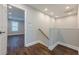 Bright hallway features recessed lighting, and hardwood floors, leading to a bedroom with a window at 200 Adeline Nw Ave, Atlanta, GA 30314