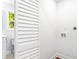 Well-lit laundry area with washer and dryer hookups, white walls, and a slatted partition at 200 Adeline Nw Ave, Atlanta, GA 30314