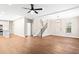 Spacious living area features wood-look floors, stairs, modern lighting, and open access to the kitchen at 200 Adeline Nw Ave, Atlanta, GA 30314