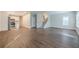 Bright living room featuring hardwood floors and an open layout with a view into the kitchen at 200 Adeline Nw Ave, Atlanta, GA 30314