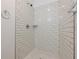 Modern shower with white subway tiles, a shower head, and built-in shelving at 200 Adeline Nw Ave, Atlanta, GA 30314