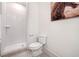 Modern bathroom features a glass-enclosed subway-tiled shower, and neutral color palette at 2664 Brown Nw St, Atlanta, GA 30318