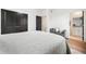 Bright main bedroom featuring neutral decor, hardwood flooring, and a view to the ensuite bathroom at 2664 Brown Nw St, Atlanta, GA 30318