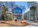 A modern home with a blue exterior and well-manicured landscaping at 2664 Brown Nw St, Atlanta, GA 30318