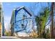 Charming two-story home showcasing fresh blue paint and tidy landscaping at 2664 Brown Nw St, Atlanta, GA 30318