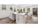 Modern kitchen island with seating and a view into the living room at 2664 Brown Nw St, Atlanta, GA 30318